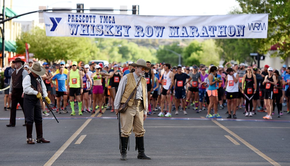 Prescott Regulators prepare for the start of the half marathon in the 38th annual Whiskey Row Marathon Saturday morning in Prescott. (Les Stukenberg/The Daily Courier)