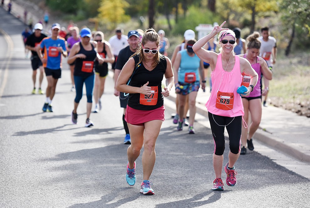 Some could still smile on the hills through Prescott in the 38th annual Whiskey Row Marathon Saturday morning in Prescott. (Les Stukenberg/The Daily Courier)