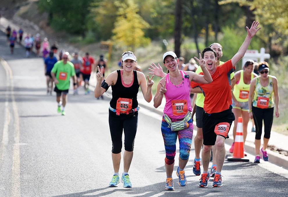 Some were having fun on the steep hills of Hassyampa Village Lane in the 38th annual Whiskey Row Marathon Saturday morning in Prescott. (Les Stukenberg/The Daily Courier)