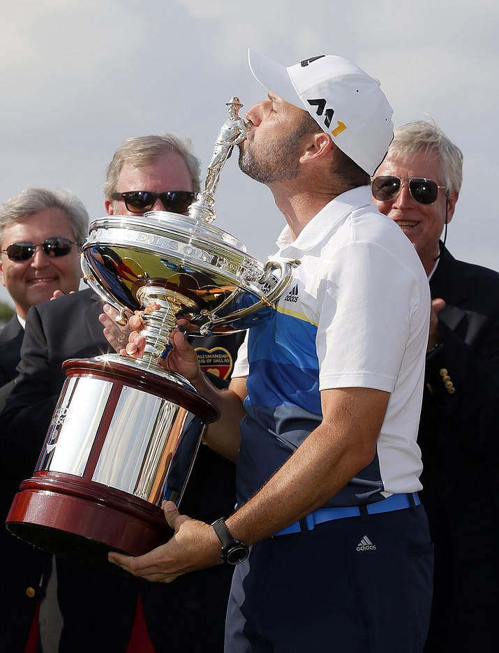 Sergio Garcia, of Spain, kisses the Byron Nelson trophy after winning the tournament Sunday in Irving, Texas.