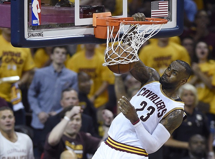 Cleveland Cavaliers forward LeBron James dunks against the Toronto Raptors during the first half of Game 5 of the NBA basketball Eastern Conference finals, Wednesday, May 25, in Cleveland.