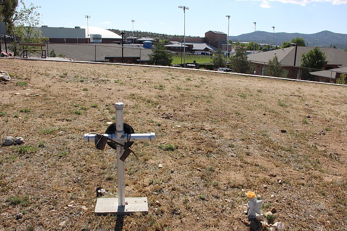 The Yavapai County Cemetery overlooks Prescott High School’s football field. The remains of 845 unidentified individuals buried in the football field were uncovered in 1961 and relocated to a mass grave near the entrance of the cemetery the same year.