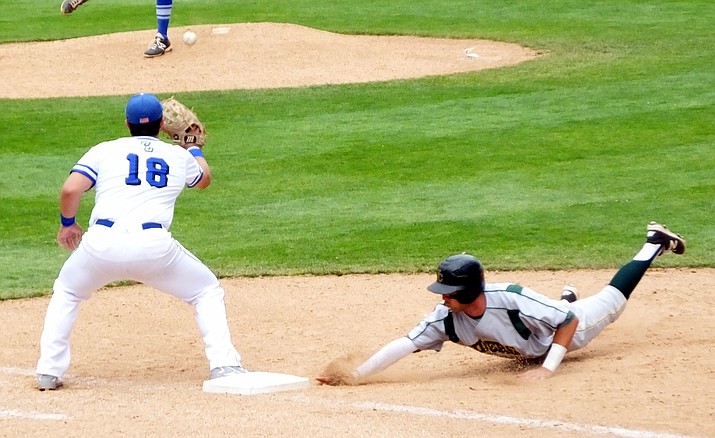 Ramsey Romano of Yavapai College dives back to first after an attempted pickoff, during action against the Cisco (Texas) Wranglers on Monday, May 30, at the 2016 Division I Junior College World Series. Romano was safe on the return and later moved to second on a base hit. 