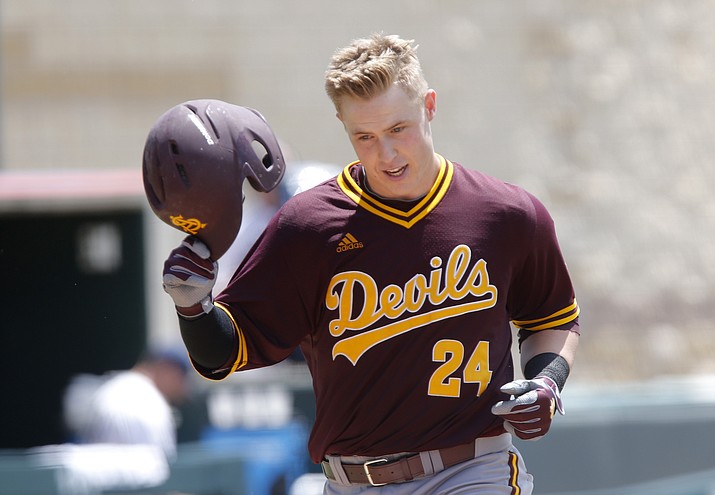 Arizona State's Brian Serven  takes off his helmet as he rounds third after hitting a two-run home run in the fifth inning against Oral Roberts during an NCAA college baseball regional tournament game, Saturday, June 4, 2016, in Fort Worth, Texas. 