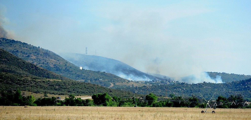 Fire burns through the hills on the south side of Yarnell Wednesday afternoon. (Les Stukenberg/The Daily Courier)