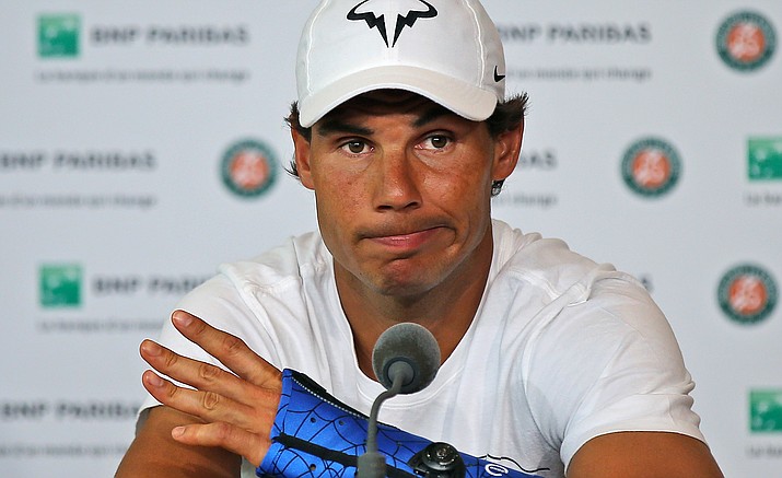 In this Friday, May 27, 2016 file photo, nine-time champion Rafael Nadal announces he is pulling out of the French Open because of an injury to his left wrist during a press conference at the Roland Garros stadium in Paris, France. Nadal has pulled out of this year's Wimbledon tournament due to a wrist injury, it was announced on Thursday, June 9.