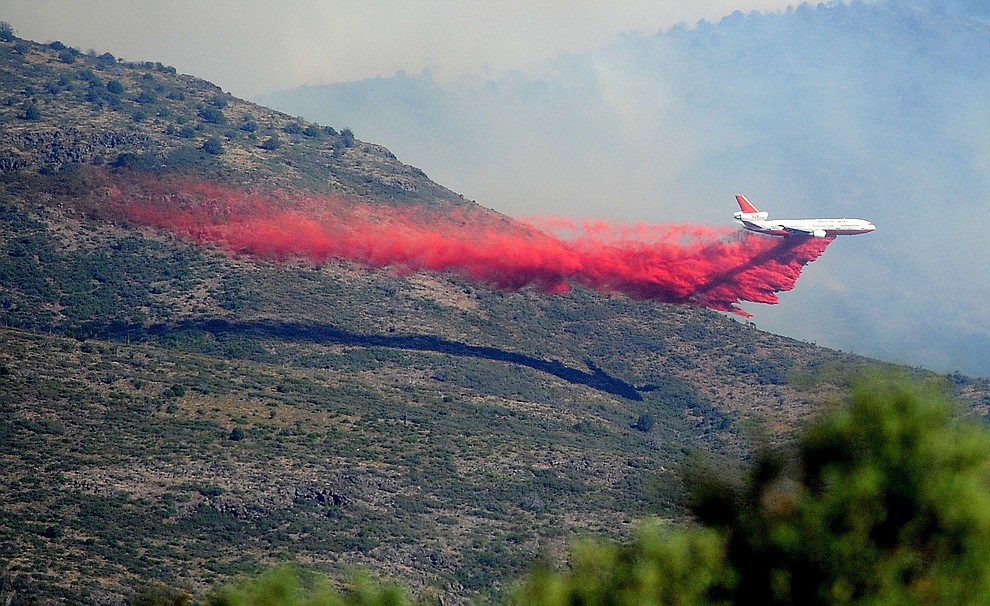 A DC-10 heavy air tanker drops a load of retardent to create fire lines around the Tenderfoot Fire near Yarnell Thursday afternoon. (Les Stukenberg/The Daily Courier)