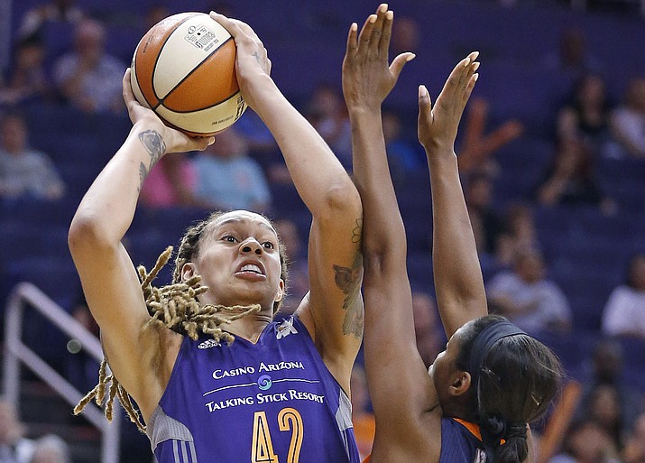 Phoenix Mercury's Brittney Griner gets off a shot over Connecticut Sun's Camille Little during the second half of a WNBA basketball game  May 31, 2016, in Phoenix. Glory Johnson knows that a lot of attention will be on her later this week when she and the Dallas Wings square off against her ex-spouse Brittney Griner and the Mercury in Phoenix on Saturday. 