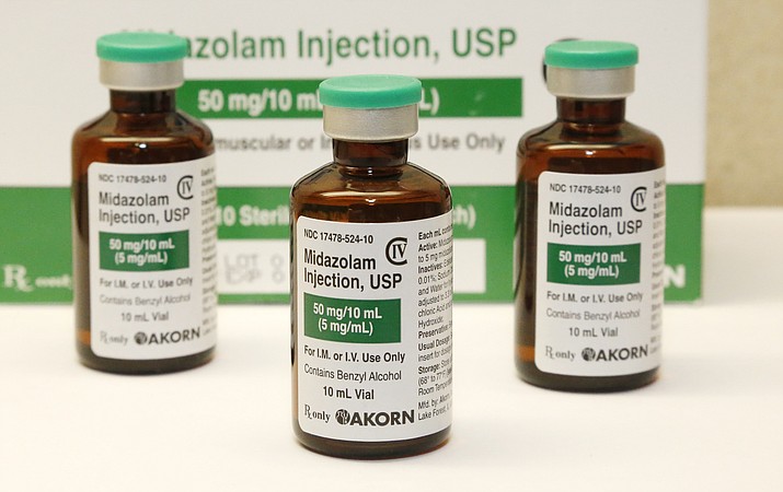 This July 25, 2014 file photo shows bottles of the sedative midazolam.