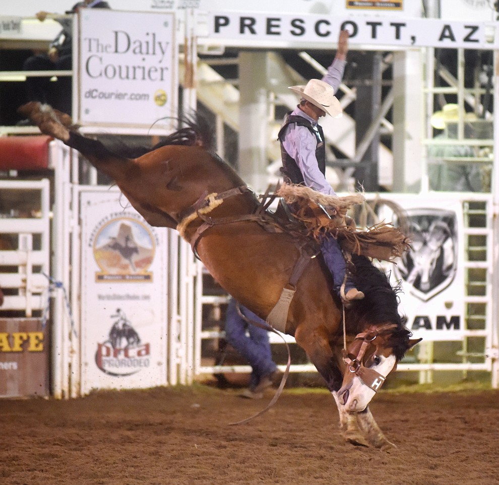 Charlie Kogianes scored 78 on Matterhorn in the Saddle Bronc Riding during the first round of the Prescott Frontier Days Rodeo Tuesday night. (Les Stukenberg/The Daily Courier)