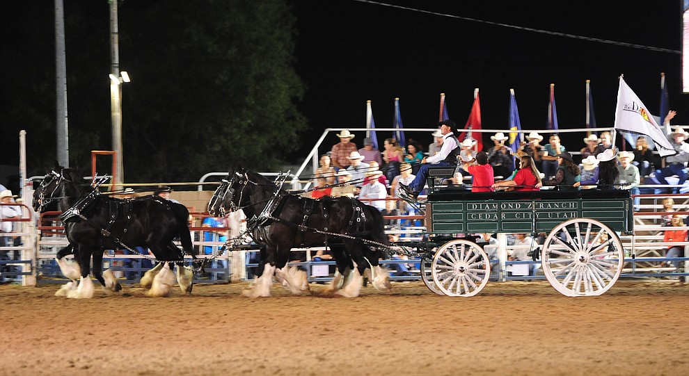 The Diamond Z English Shire Horses perform during the first round of the Prescott Frontier Days Rodeo Tuesday night. (Les Stukenberg/The Daily Courier)