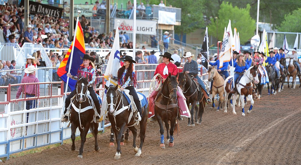 The GRand Entry opens the first round of the Prescott Frontier Days Rodeo Tuesday night. (Les Stukenberg/The Daily Courier)