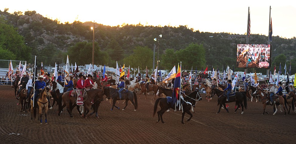 The grand entry opens the first round of the Prescott Frontier Days Rodeo Tuesday night. (Les Stukenberg/The Daily Courier)