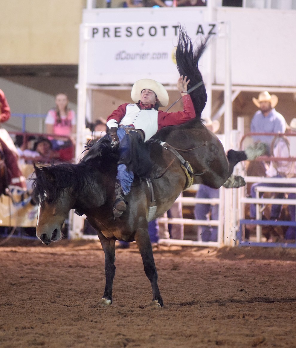 Nate McFadden rides Wrangler Valley for a 74 in the Bareback during the first round of the Prescott Frontier Days Rodeo Tuesday night. (Les Stukenberg/The Daily Courier)