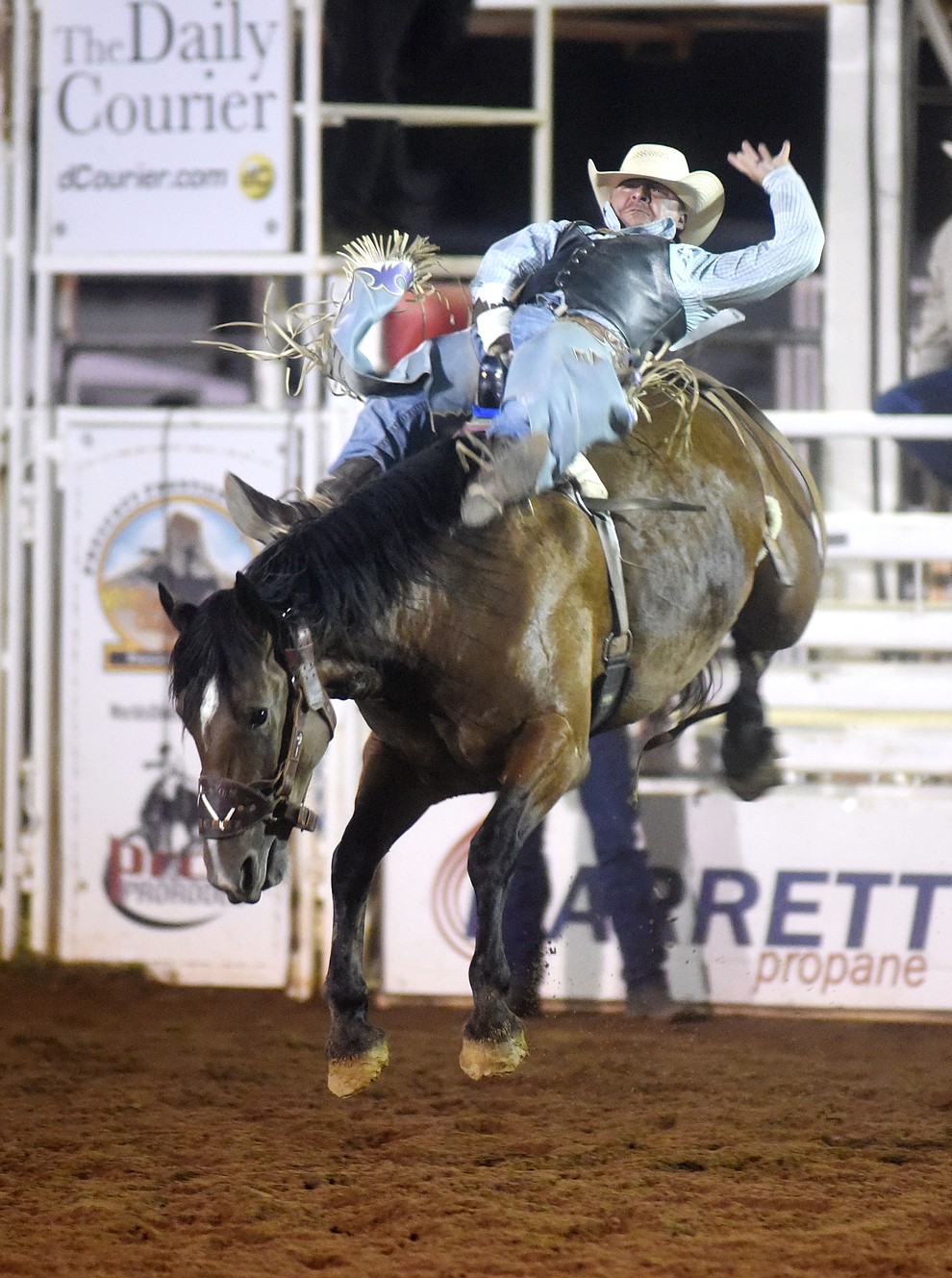 Scotty Nesmith scores 80 on Wilson Sanchez in the Bareback during the first round of the Prescott Frontier Days Rodeo Tuesday night. (Les Stukenberg/The Daily Courier)