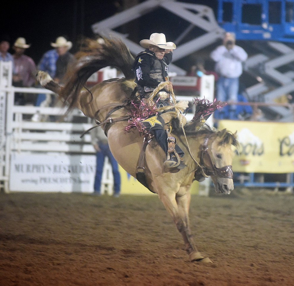 Shane Proctor scored 78 on Honey Badger in the Saddle Bronc Riding during the first round of the Prescott Frontier Days Rodeo Tuesday night. (Les Stukenberg/The Daily Courier)