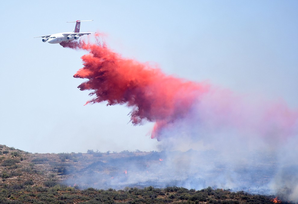 A heavy air tanker drops a load of retardent to create fire lines on the Bug Creek Fire near Cordes Lakes Tuesday afternoon. (Les Stukenberg/The Daily Courier)