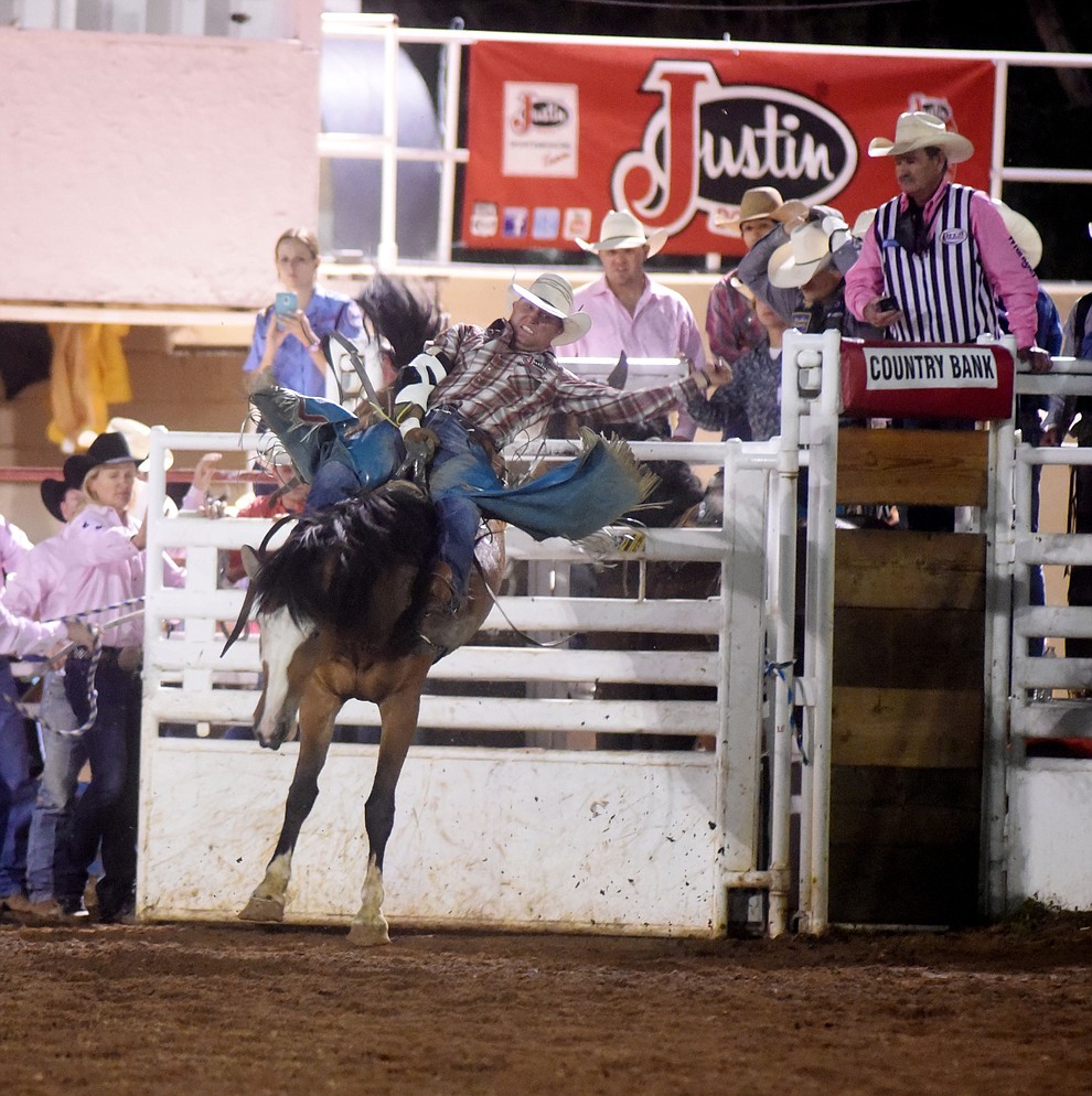 Heath Ford rides I'ma Be in the Bareback during the second round of the Prescott Frontier Days Rodeo Wednesday night. (Les Stukenberg/The Daily Courier)