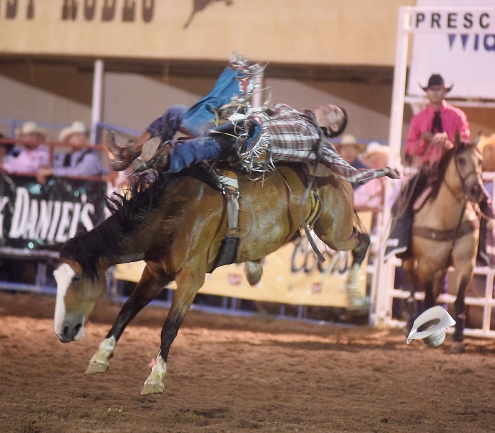 Heath Ford rides I'ma Be in the bareback during the second round of the Prescott Frontier Days Rodeo Wednesday night. (Les Stukenberg/The Daily Courier)
