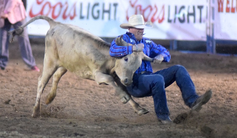 Jarrett New was 7.6 seconds on his steer wrestling run during the second round of the Prescott Frontier Days Rodeo Wednesday night. (Les Stukenberg/The Daily Courier)