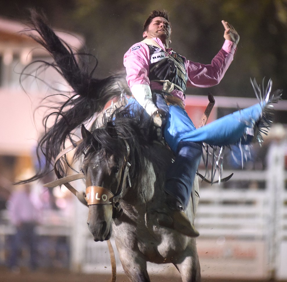 Luke Creasy rides First Class in the Bareback for a score of 79 during the second round of the Prescott Frontier Days Rodeo Wednesday night. (Les Stukenberg/The Daily Courier)