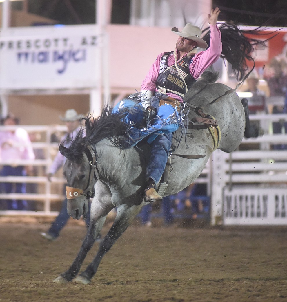 Luke Creasy rides First Class in the Bareback for a score of 79 during the second round of the Prescott Frontier Days Rodeo Wednesday night. (Les Stukenberg/The Daily Courier)