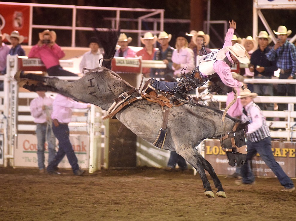 Mitch Pollock goes airborne off Blue Swan during the second round of the Prescott Frontier Days Rodeo Wednesday night. (Les Stukenberg/The Daily Courier)