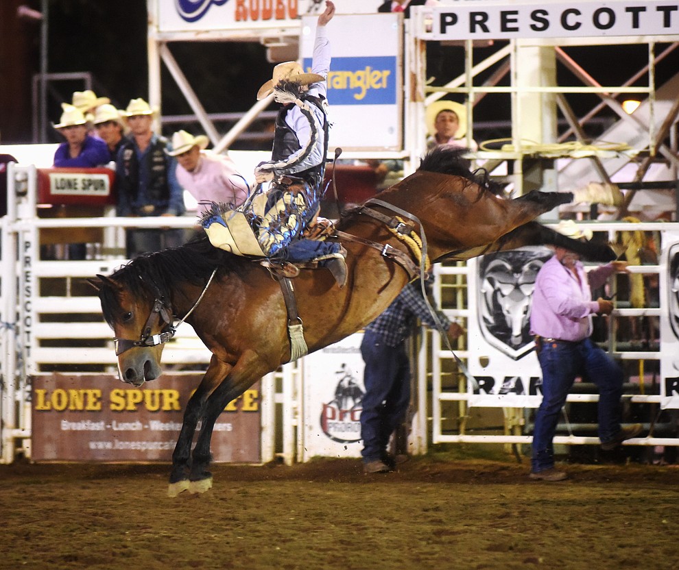 Taos Muncy scored 79.5 on Sun Glow during the second round of the Prescott Frontier Days Rodeo Wednesday night. (Les Stukenberg/The Daily Courier)