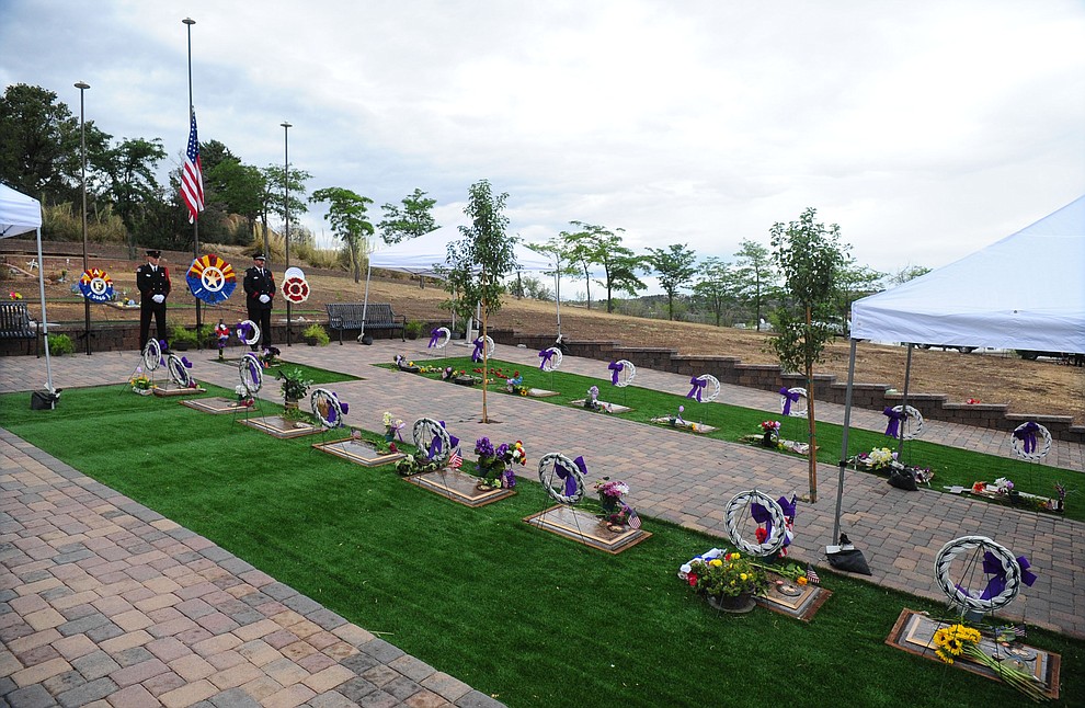 An Honor Guard will stand watch all day following a Celebration of Remembrance ceremony at the Arizona Pioneer's Home Cemetery on the third anniversary of the death's of the 19 Granite Mountain Hotshots while fighting the Yarnell Hill Fire. (Les Stukenberg/The Daily Courier)