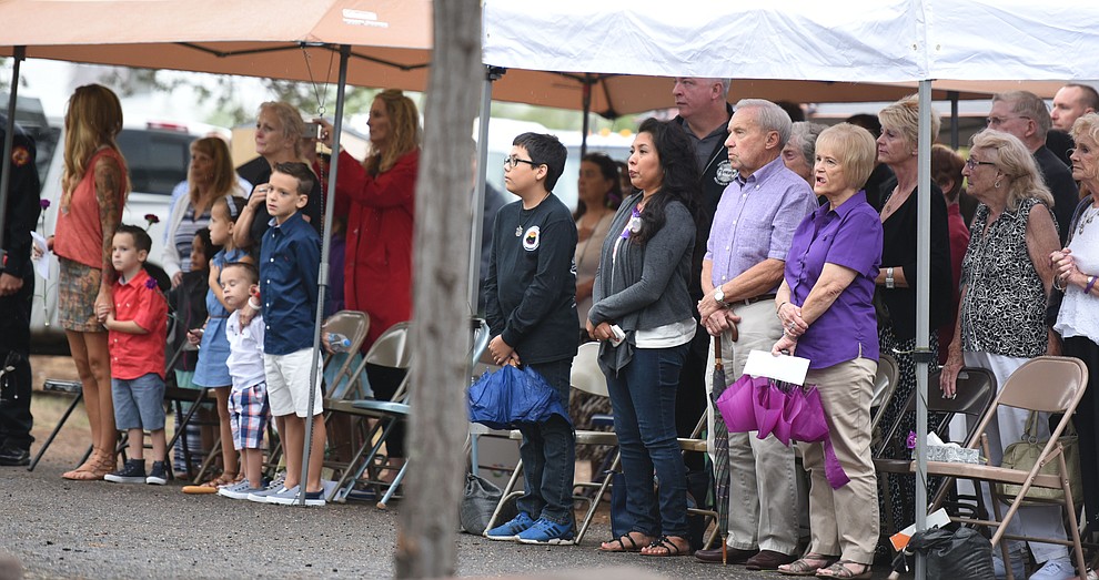Family members, friends and coworkers gather for a Celebration of Remembrance ceremony at the Arizona Pioneer's Home Cemetery on the third anniversary of the death's of the 19 Granite Mountain Hotshots while fighting the Yarnell Hill Fire. (Les Stukenberg/The Daily Courier)