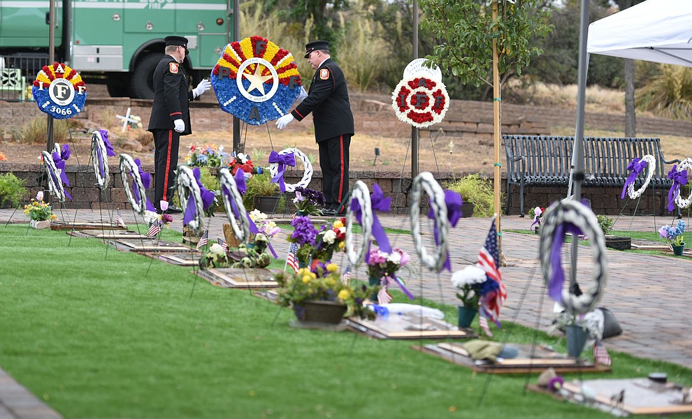 Honor Guard members place a wreath during a Celebration of Remembrance ceremony at the Arizona Pioneer's Home Cemetery on the third anniversary of the death's of the 19 Granite Mountain Hotshots while fighting the Yarnell Hill Fire. (Les Stukenberg/The Daily Courier)