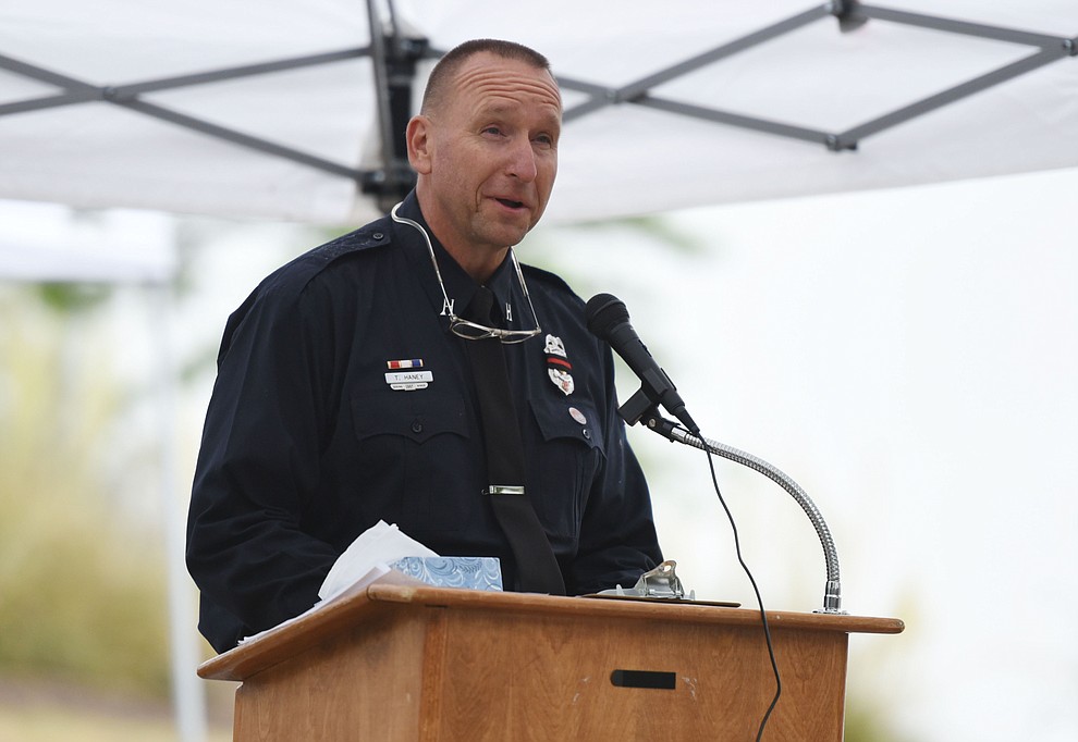 Tom Haney makes opening remarks during a Celebration of Remembrance ceremony at the Arizona Pioneer's Home Cemetery on the third anniversary of the death's of the 19 Granite Mountain Hotshots while fighting the Yarnell Hill Fire. (Les Stukenberg/The Daily Courier)