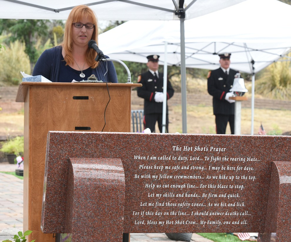 Trish Huston, author of the Hotshot's Prayer and wife of a Hotshot Superintendent, reads the prayer during a Celebration of Remembrance ceremony at the Arizona Pioneer's Home Cemetery on the third anniversary of the death's of the 19 Granite Mountain Hotshots while fighting the Yarnell Hill Fire. (Les Stukenberg/The Daily Courier)