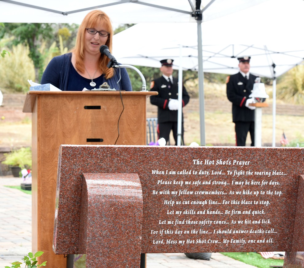 Trish Huston, author of the Hotshot's Prayer and wife of a Hotshot Superintendent, reads the prayer during a Celebration of Remembrance ceremony at the Arizona Pioneer's Home Cemetery on the third anniversary of the death's of the 19 Granite Mountain Hotshots while fighting the Yarnell Hill Fire. (Les Stukenberg/The Daily Courier)