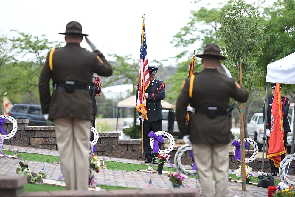 Honor Guard members present the colors during a Celebration of Remembrance ceremony at the Arizona Pioneer's Home Cemetery on the third anniversary of the death's of the 19 Granite Mountain Hotshots while fighting the Yarnell Hill Fire. (Les Stukenberg/The Daily Courier)