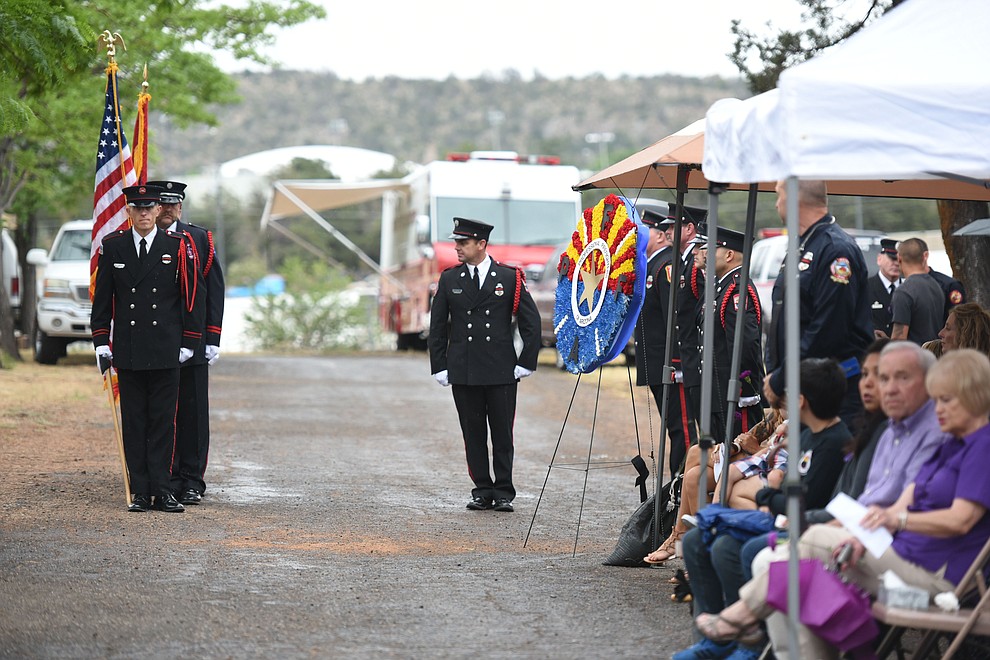 Honor Guard present the colors during a Celebration of Remembrance ceremony at the Arizona Pioneer's Home Cemetery on the third anniversary of the death's of the 19 Granite Mountain Hotshots while fighting the Yarnell Hill Fire. (Les Stukenberg/The Daily Courier)