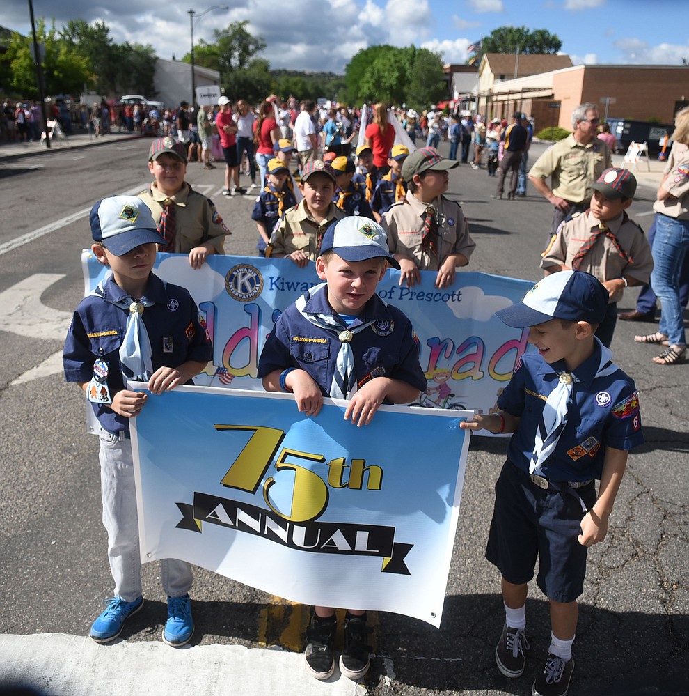 Cub Scouts lead the way during the 75th annual Kiwanis Kiddie Parade through downtown Prescott Friday morning. (Les Stukenberg/The Daily Courier)