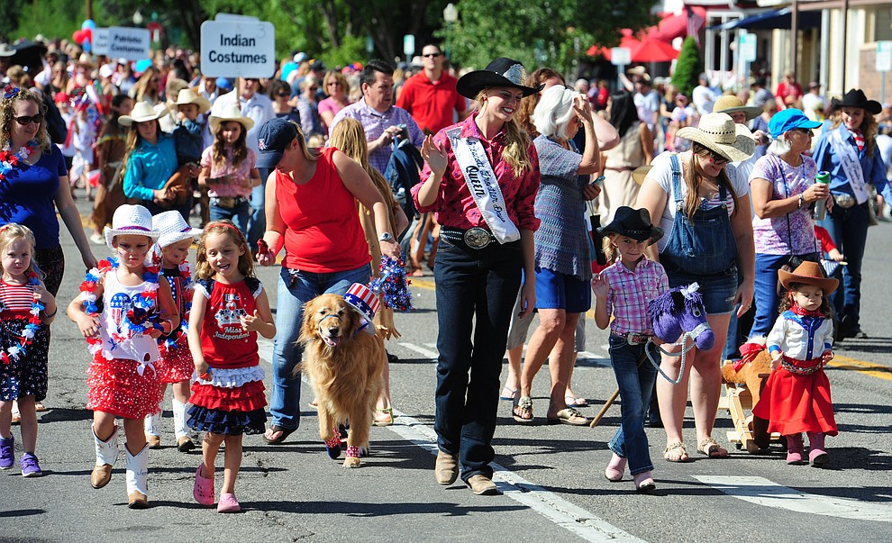 Rodeo royalty and little cowgirls march during the 75th annual Kiwanis Kiddie Parade through downtown Prescott Friday morning. (Les Stukenberg/The Daily Courier)