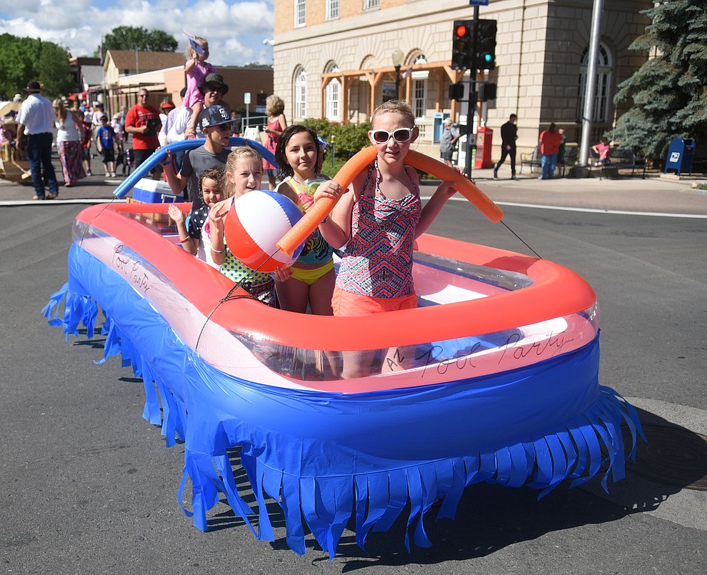 Swimming their way down Cortez Street during the 75th annual Kiwanis Kiddie Parade through downtown Prescott Friday morning. (Les Stukenberg/The Daily Courier)