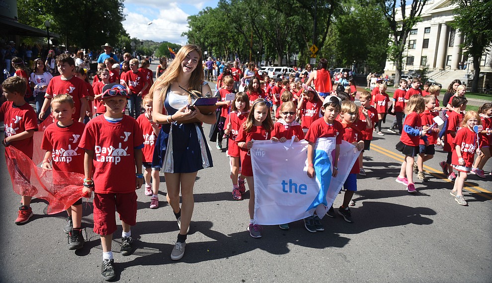 Prescott YMCA day campers march as group during the 75th annual Kiwanis Kiddie Parade through downtown Prescott Friday morning. (Les Stukenberg/The Daily Courier)