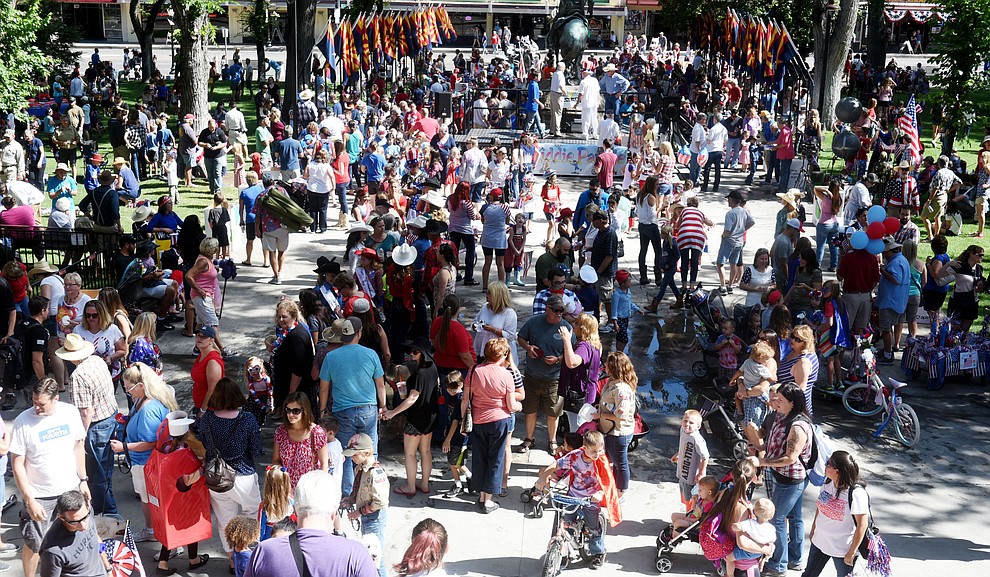 Crowds gather for awards and ice cream sandwiches following the 75th annual Kiwanis Kiddie Parade through downtown Prescott Friday morning. (Les Stukenberg/The Daily Courier)