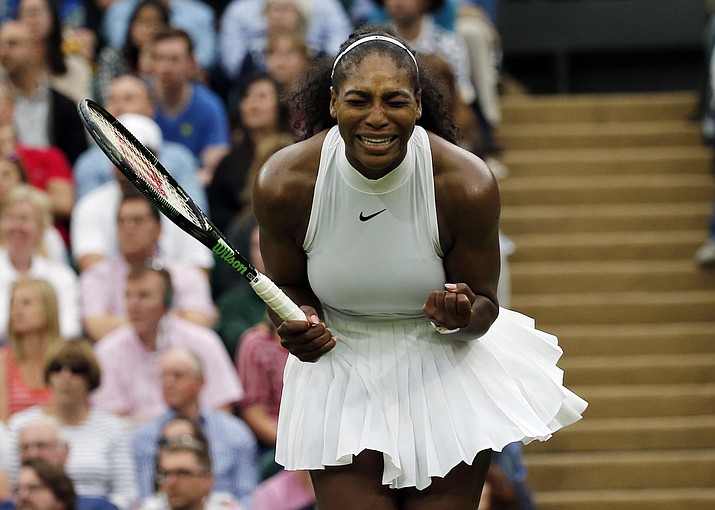 Serena Williams reacts as she misses a shot against Christina McHale during their women's single match on day five of the Wimbledon Tennis Championships in London, Friday, July 1.