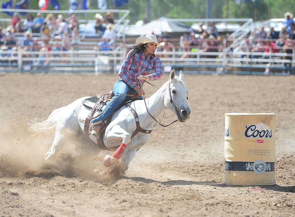Erin Parsons turning the third barrel during the final performance of the 2016 Prescott Frontier Days Rodeo Monday afternoon. (Les Stukenberg/The Daily Courier)