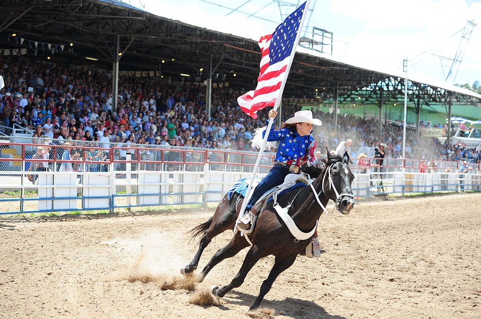 Bringing the American Flag into the arena during the final performance of the 2016 Prescott Frontier Days Rodeo Monday afternoon. (Les Stukenberg/The Daily Courier)