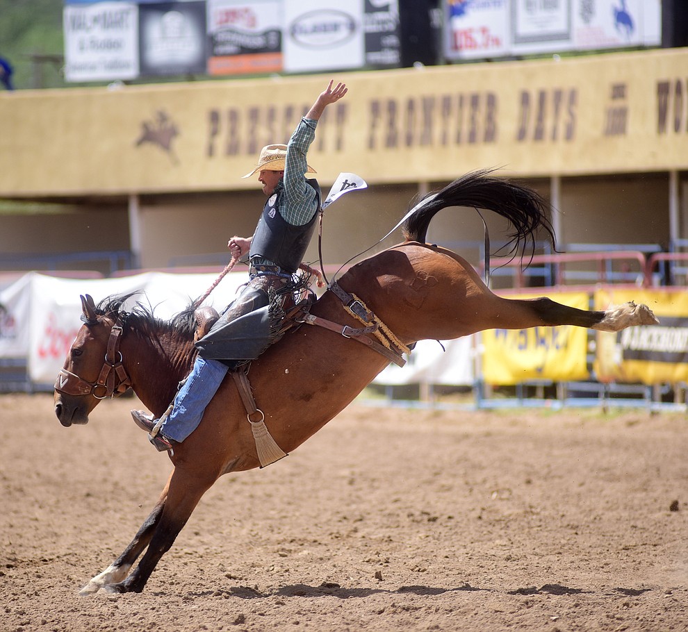 James Greeson on Music Man during the final performance of the 2016 Prescott Frontier Days Rodeo Monday afternoon. (Les Stukenberg/The Daily Courier)