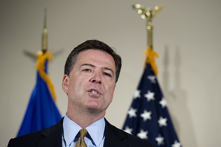 FBI Director James Comey makes a statement at FBI Headquarters in Washington, Tuesday, July 5, 2016. Comey said the FBI will not recommend criminal charges in its investigation into Hillary Clinton's use of a private email server while secretary of state. 