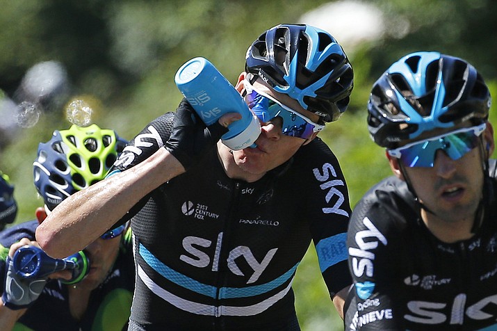 Britain’s Chris Froome drinks as he follows teammate Spain Mikel Nieve Iturralde during the fifth stage of the Tour de France cycling race over 216 kilometers (134.2 miles) with start in Limoges and finish in Le Lioran, France, Wednesday.
