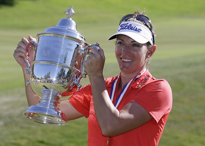 Brittany Lang poses with her trophy on the 18th green after winning the U.S. Women's Open golf tournament at CordeValle, Sunday, July 10, in San Martin, Calif. 
