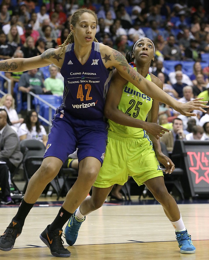 Dallas Wings forward Glory Johnson (25) is blocked by Phoenix Mercury center Brittney Griner (42) during the second half of a WNBA basketball game in Arlington, Texas, Tuesday, July 5. The Wings won 77-74.