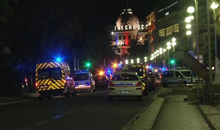 In this video grab taken Thursday July 14, 2016, ambulances and Police cars are seen after a truck drove on to the sidewalk and plowed through a crowd of revelers who’d gathered to watch the fireworks in the French resort city of Nice. officials and eyewitnesses described as a deliberate attack. There appeared to be many casualties.